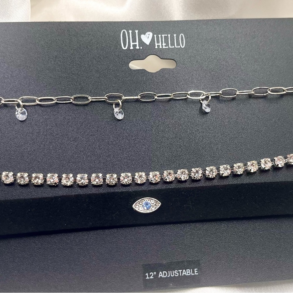 jewelry set from the brand OH❤HELLO features three distinct silver-toned chokers
